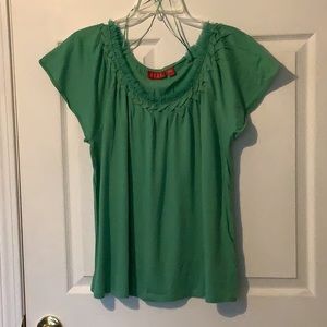 Elle Light Green short sleeve top w/fringe accent around neck.